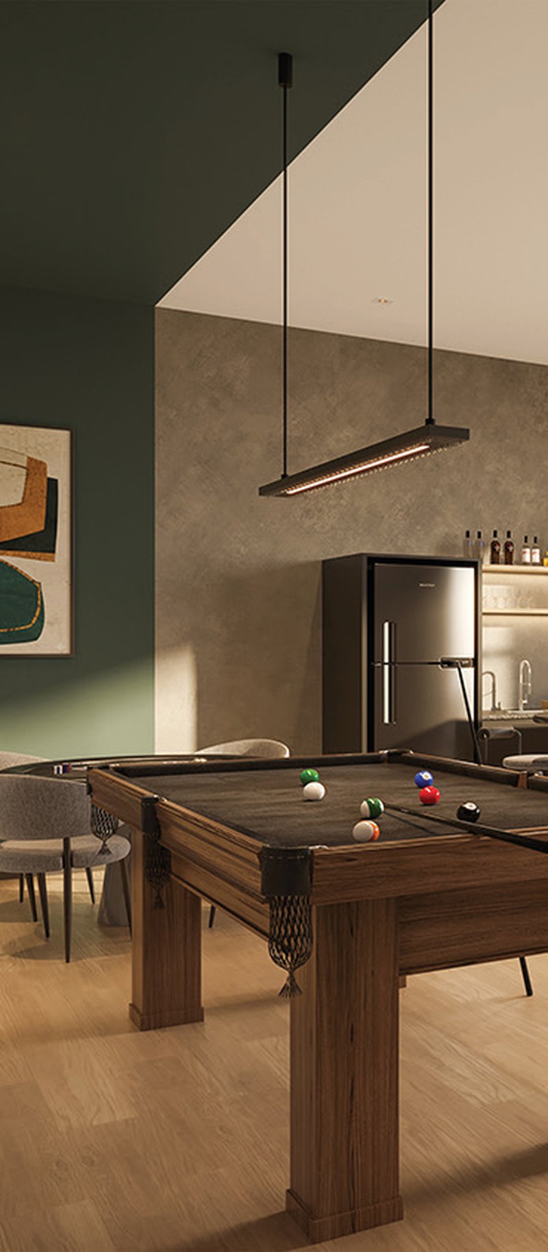 Sala de jogos do Elevvo, com mesa de sinuca e cozinha integrada.